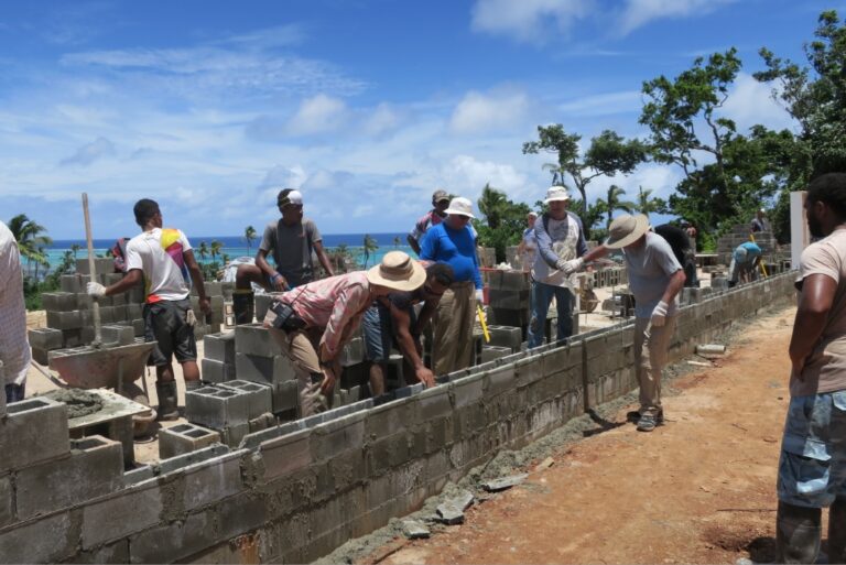 The local and Canadian construction crews working on the reinforced walls.