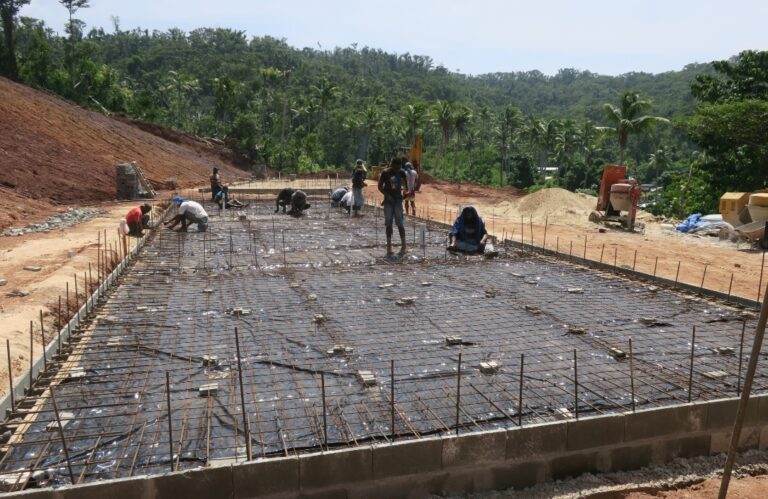 Laying rebar for the concrete floor.