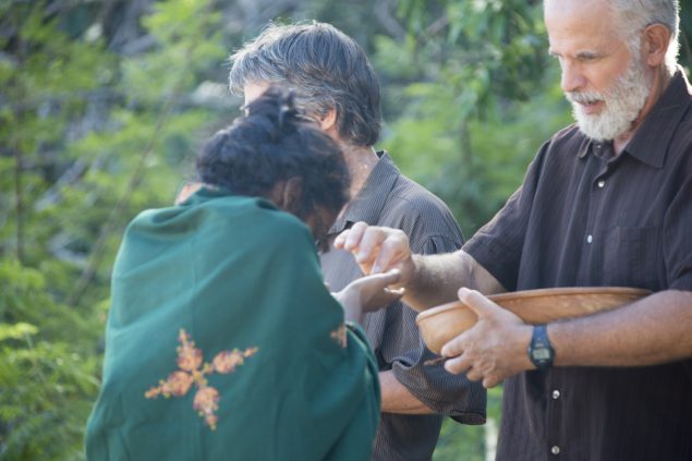 Devotee receiving prasad